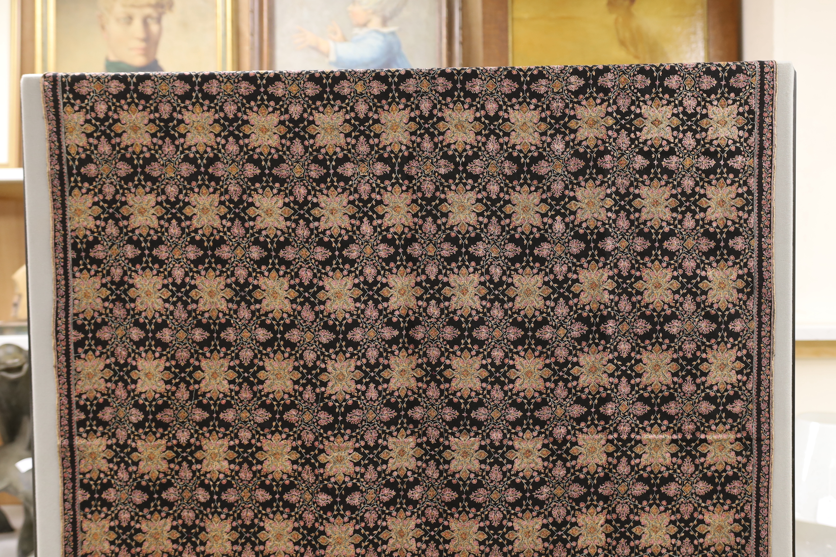 A very finely hand embroidered multicoloured silk black cashmere stole, with embroidered signature and number, 198cm long x 95cm wide